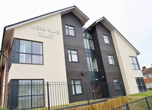 Large sign on the side of the building entrance to Webb Ellis Court