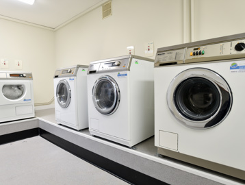 Communal laundry room at Acre Court