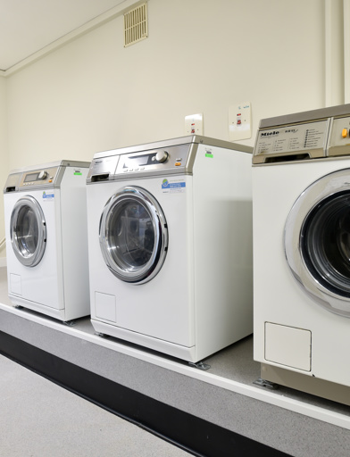 Communal laundry room at Acre Court