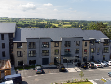 Birds eye view of the front entrance of Bowland View, showing the front and roof of the scheme with a car park