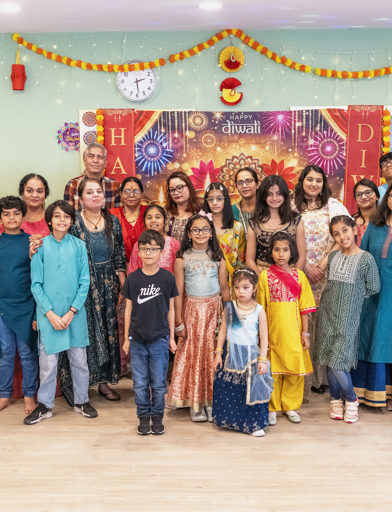 A photo of the community group all in traditional dress 