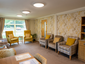 Communal lounge with yellow seats and decor