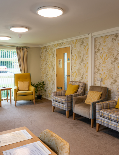 Communal lounge with yellow seats and decor