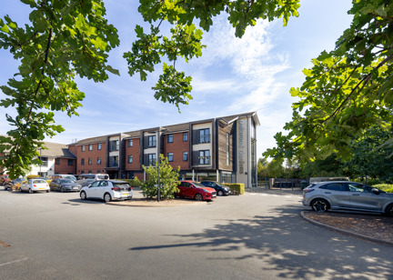 Front outer building of Oakwood Gardens with a car park situated at the front