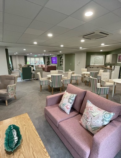 Cosy sofas, armchairs, coffee tables and seating areas in a modern communal living room