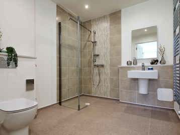 Wet room bathroom at Filey Fields featuring a toilet, walk in shower and sink 