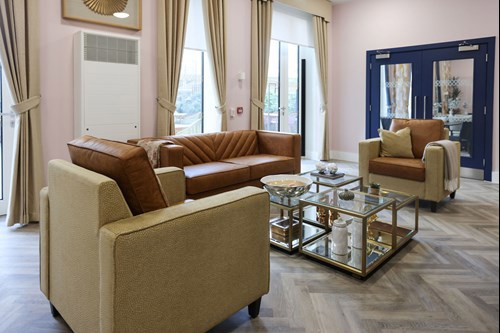 A photograph of a stylish seating area in a communal lounge area