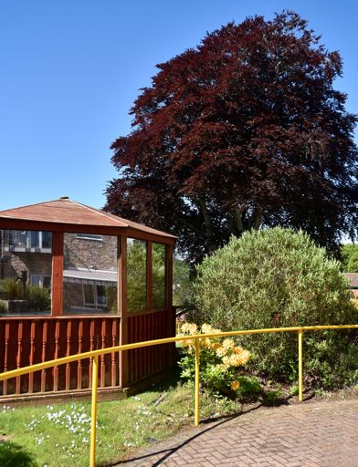 Wooden veranda in the communal area outside of the scheme 