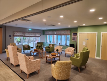 Residents lounge with soft seating and coffee tables