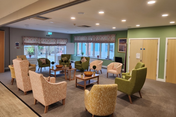 Residents lounge with soft seating and coffee tables