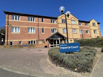 Outer building of Imperial Court surrounded by greenery 