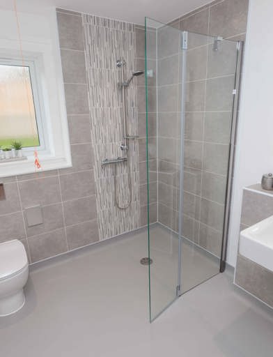 A photo of a bathroom with accessible showering facilities at Castlestead View 