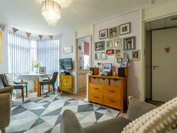 A living room with table and chairs