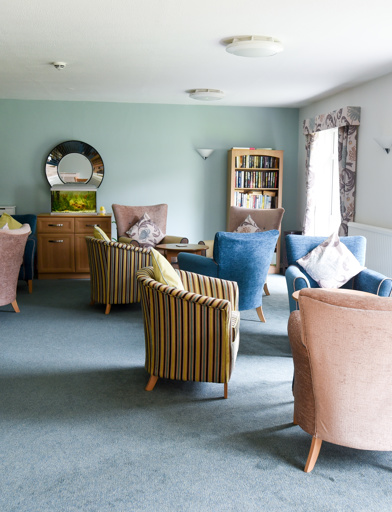 Soft seating and coffee tables in the residents' lounge