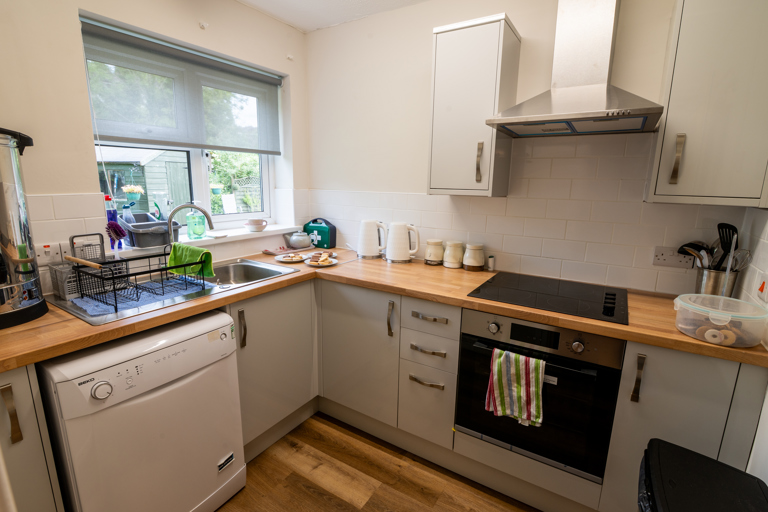 Kitchen with sink, dishwater, oven and hob
