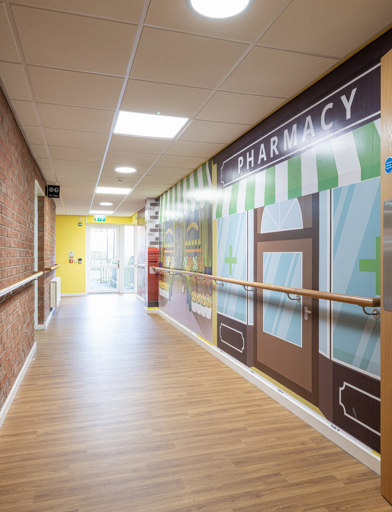a hallway with murial 