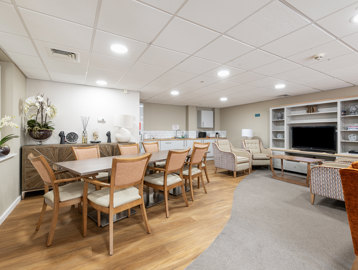 a communal kitchen with dining table