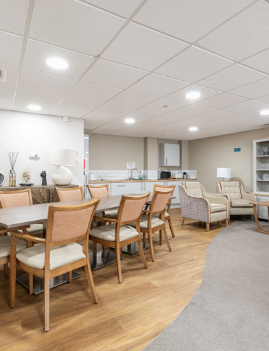 a communal kitchen with dining table 