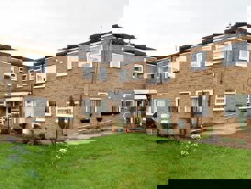 A photo of the side of the building and garden area at Fullylove Court