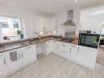A photo of the open plan kitchen in a bungalow at Castlestead View