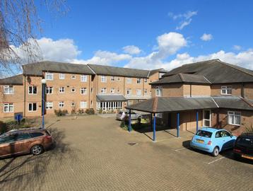 Car park and entrance to the side of Anne Figg Court