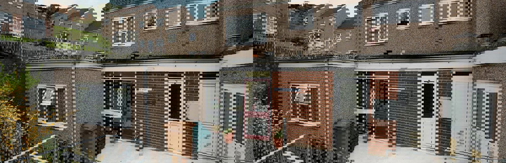 Outside space to the back of the scheme with steps down to the back door