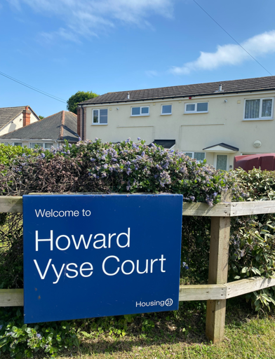 Howard Vyse sign attached to the fencing at the front of the scheme 