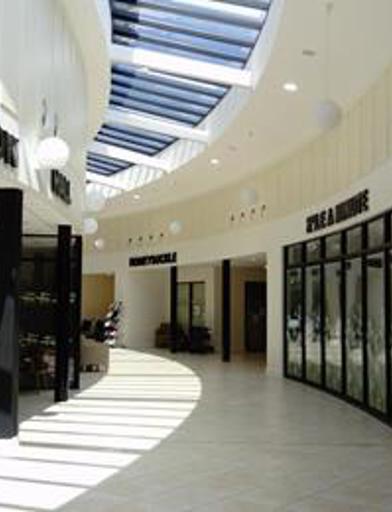A photo of the large curved corridor with communal rooms either side