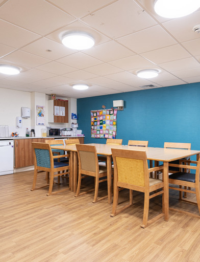 a communal kitchen with dining table 