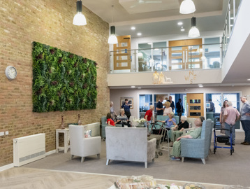 Residents relaxing together in the communal lounge at Green Lane View