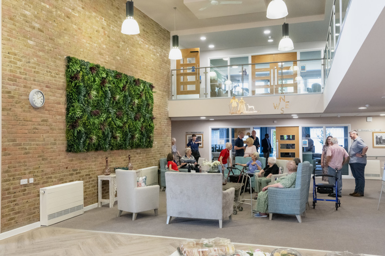 Residents relaxing together in the communal lounge at Green Lane View