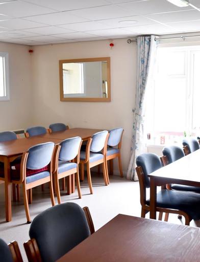 Tables and chairs in the communal dining area of the cafe/ bistro 
