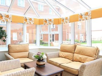 Large rattan garden furniture in the communal conservatory