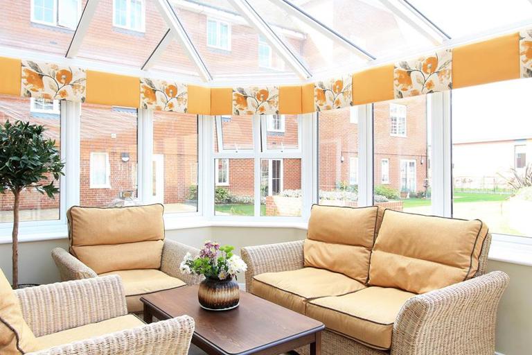Large rattan garden furniture in the communal conservatory