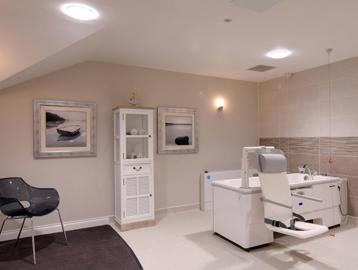 Communal assisted bathroom with bath hoist