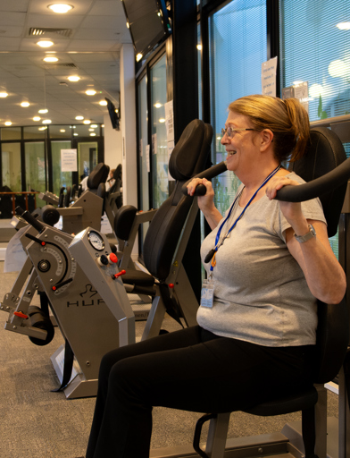 A female resident enjoying the facilities in the on-site gym 
