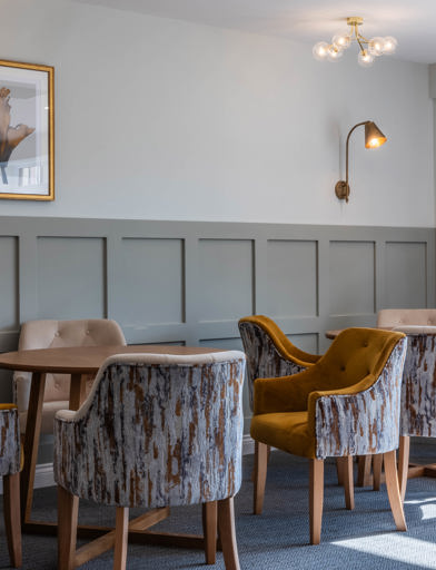 Large communal area with seating and tables to relax in 