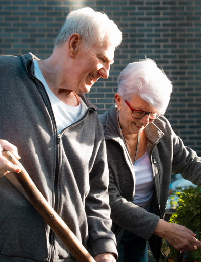 A couple in the allotment of the communal gardens at Lime Gardens 