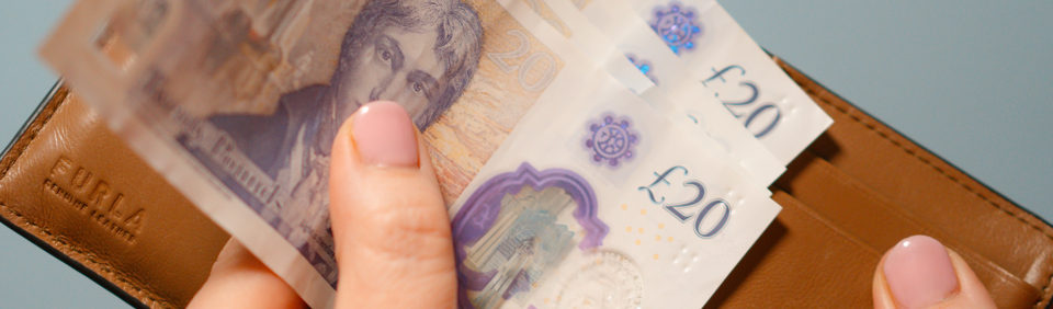 A hand holding money 